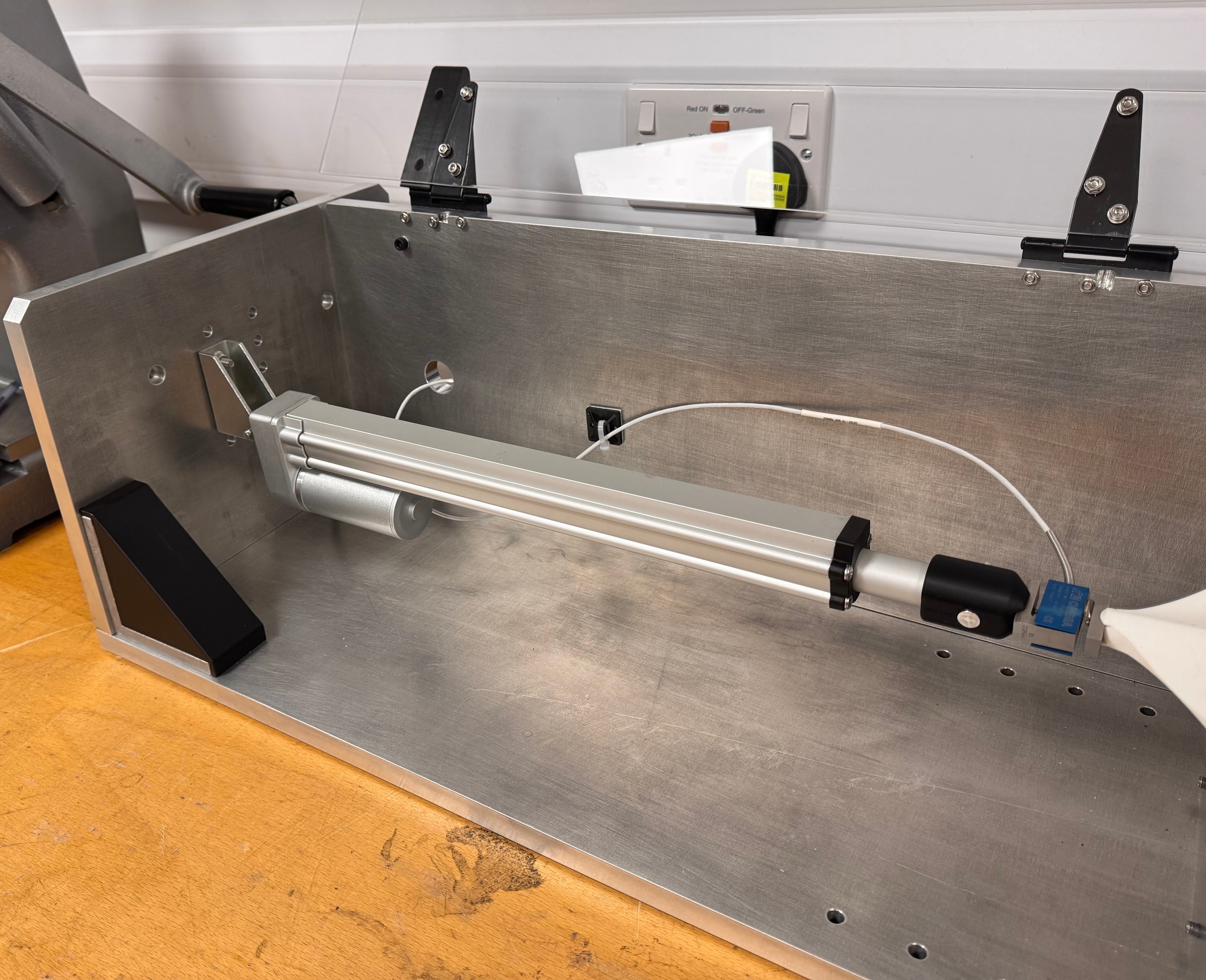 Manufactured life-test fixture showing its adjustable linear actuator